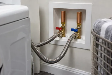 Washing-machine supply connections with compact water-hammer arrestors.